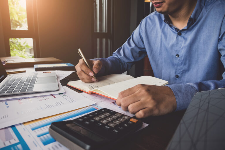 Person Calculating Expenses